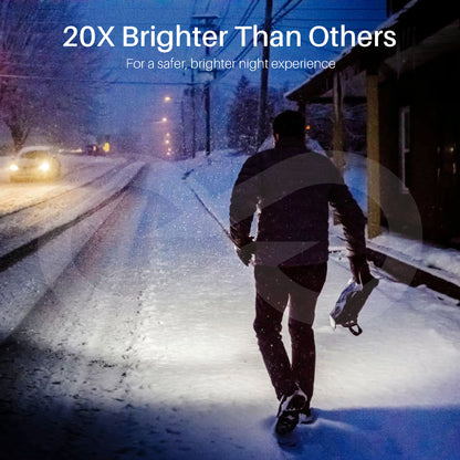 Person walking on a snow-covered road at night with text '20X Brighter Than Others' and 'For a safer, brighter night experience'.