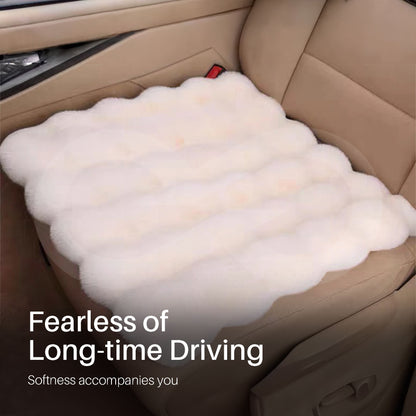 Car seat cushion on a car seat with text 'Fearless of Long-time Driving' and 'Softness accompanies you'.