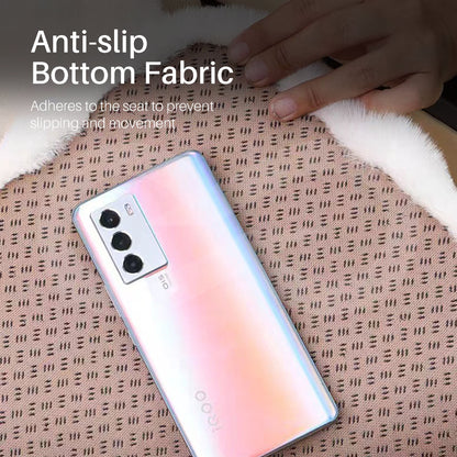 Smartphone on a textured surface, highlighting anti-slip bottom fabric feature.