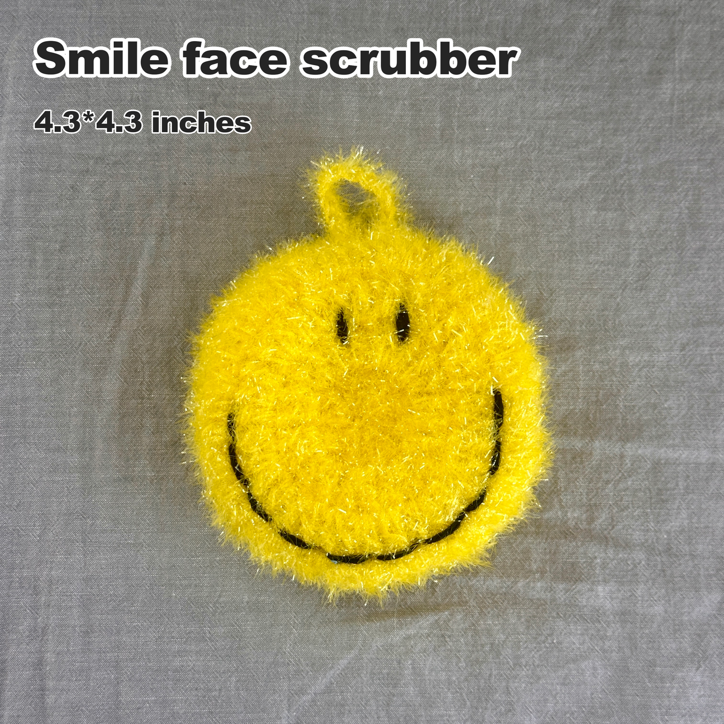 Yellow smile face scrubber on a gray background