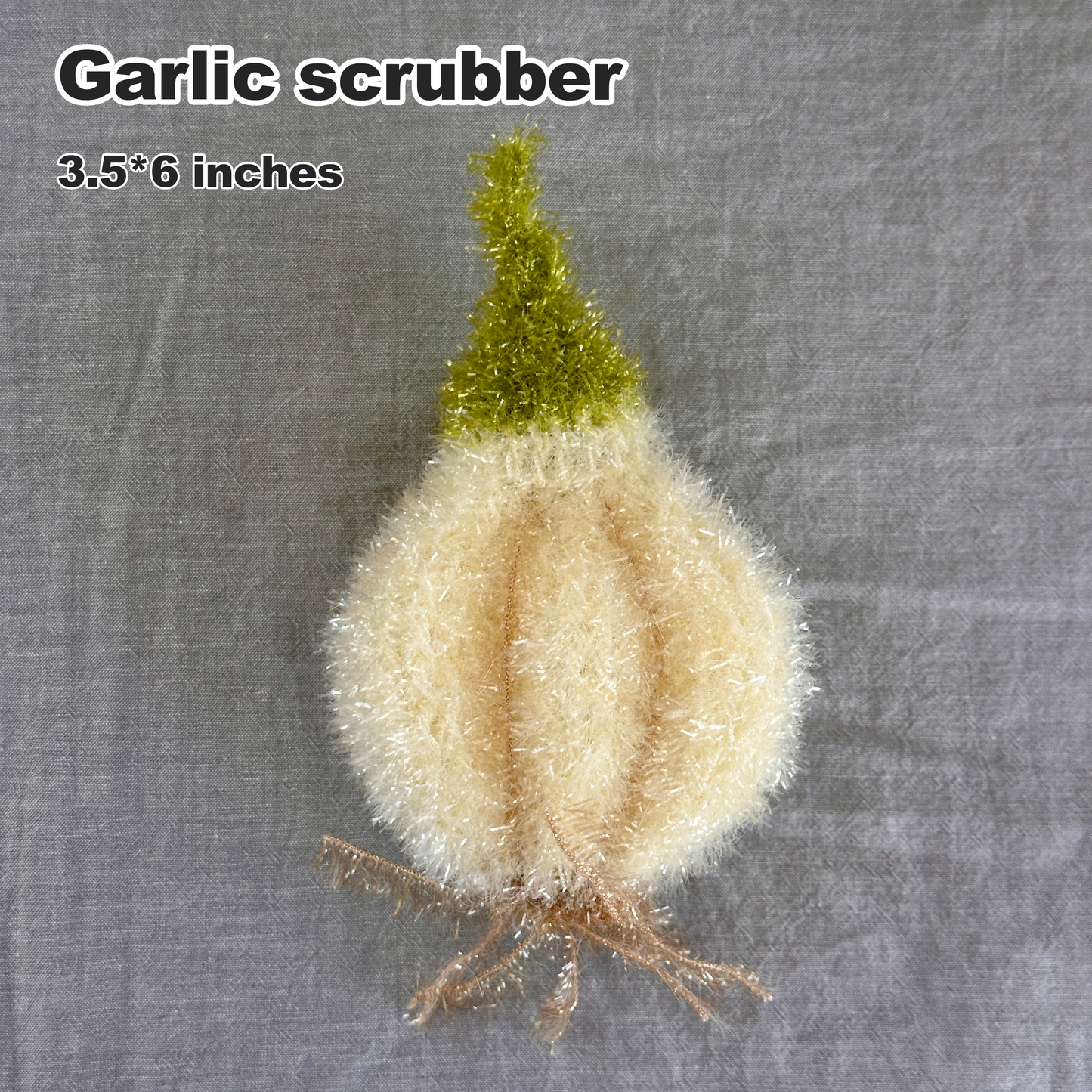Garlic scrubber with green top on a gray background